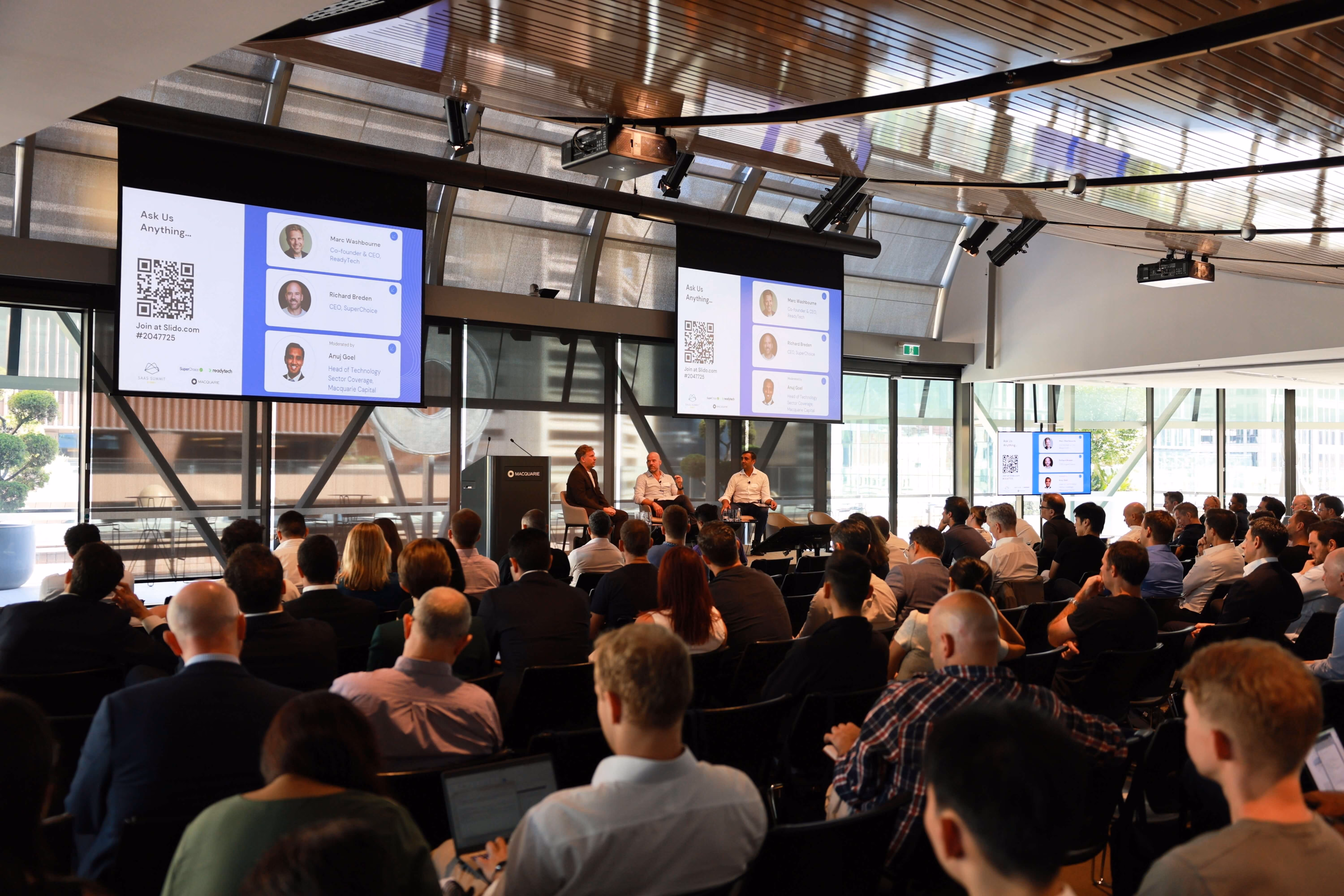 Panelists talking on stage