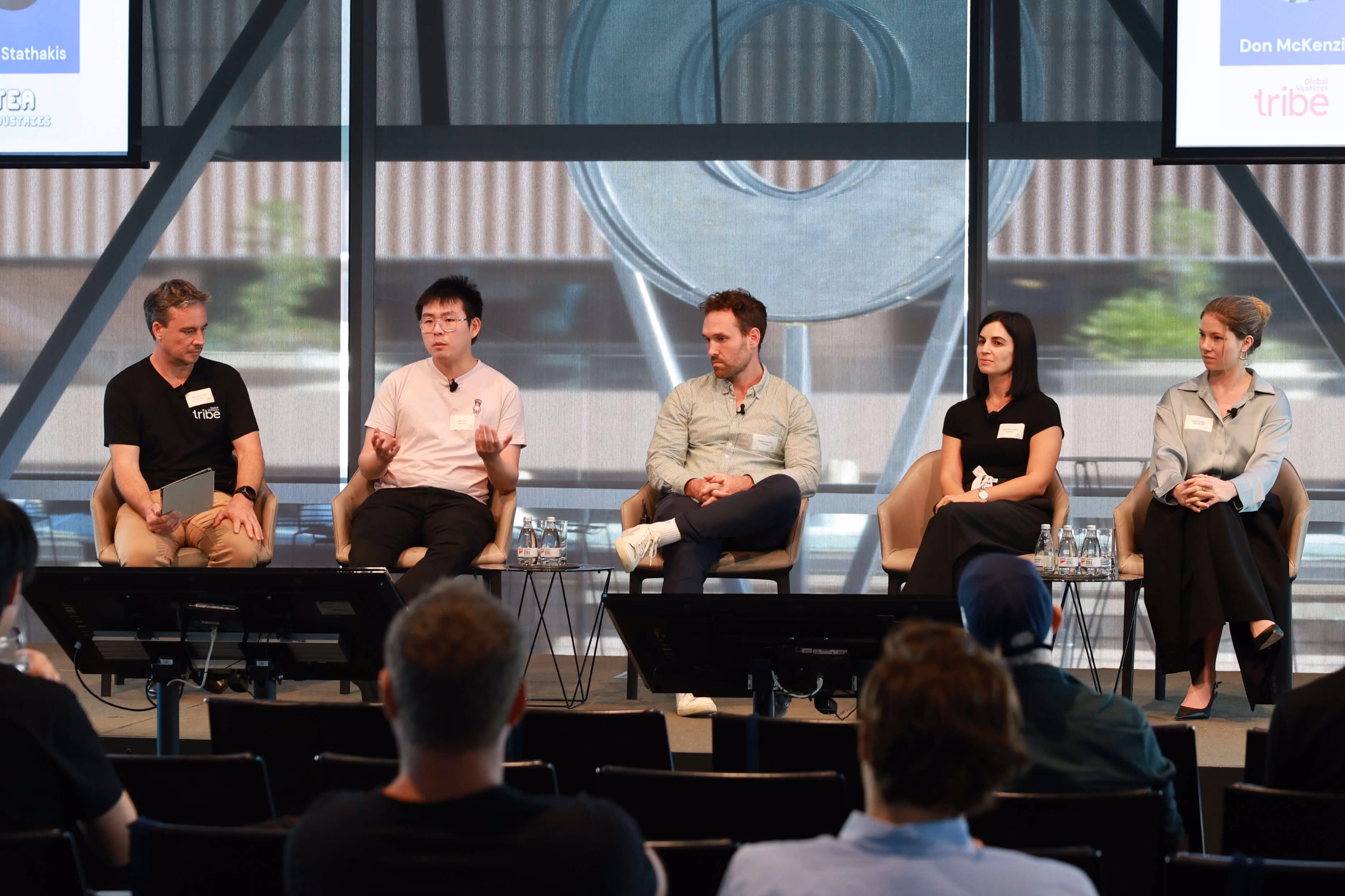 Panelists talking on stage
