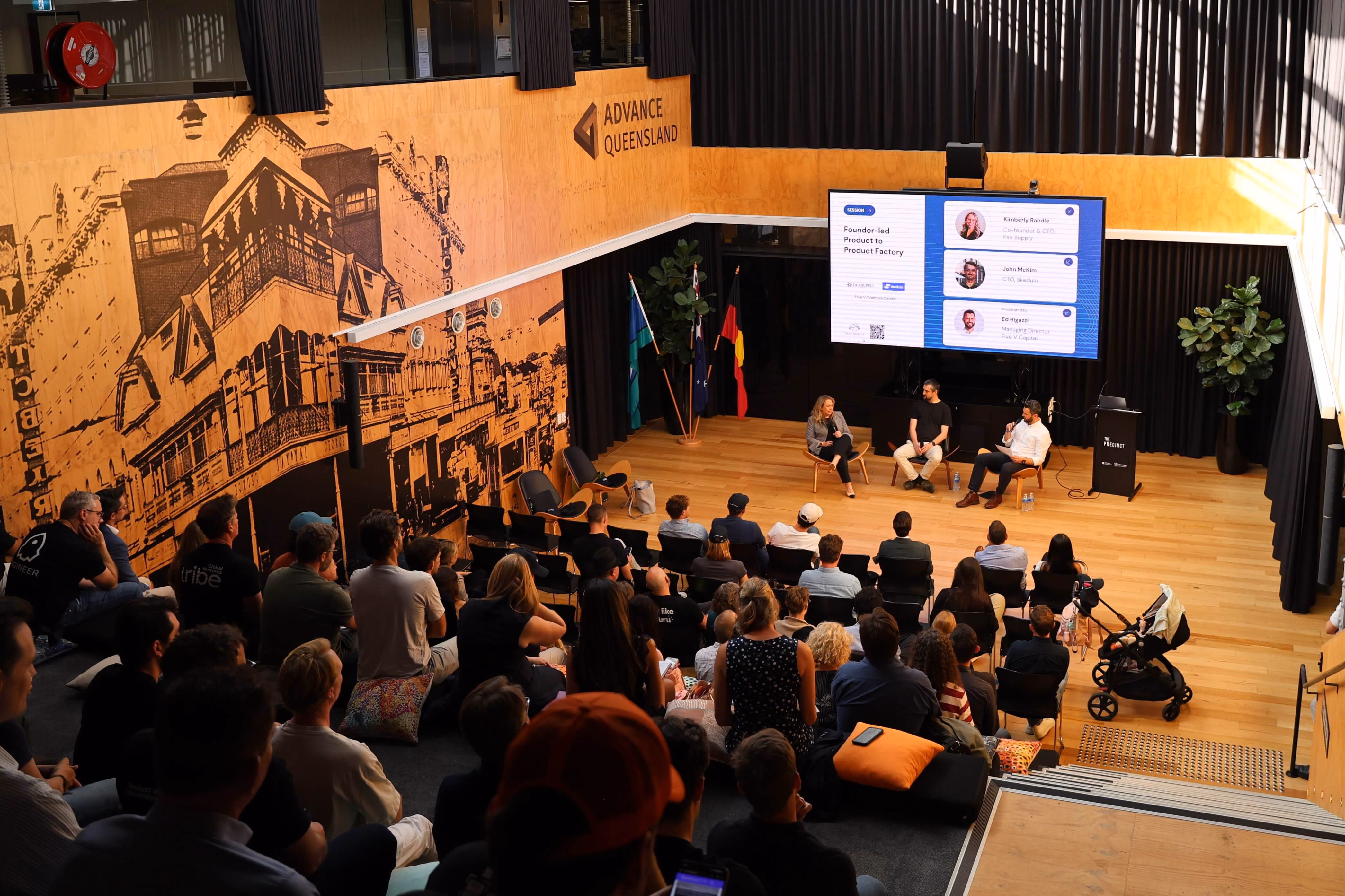 Panelists talking on stage