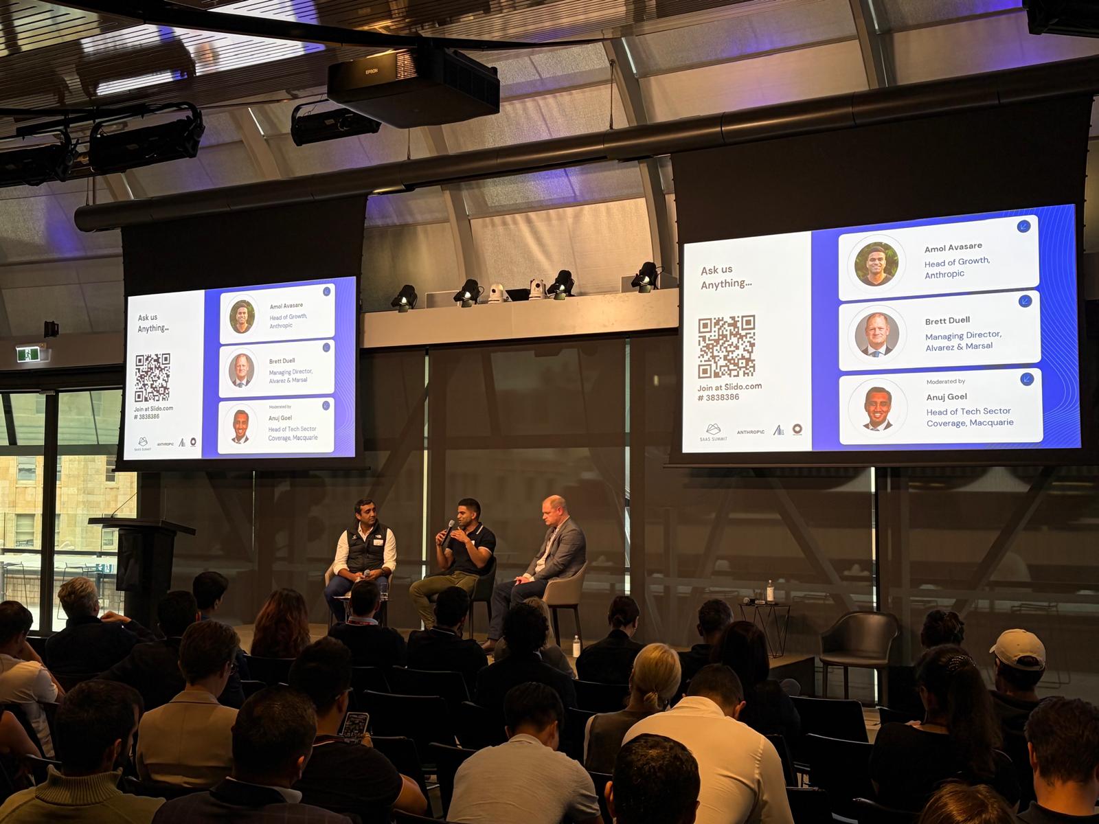 Panelists talking on stage