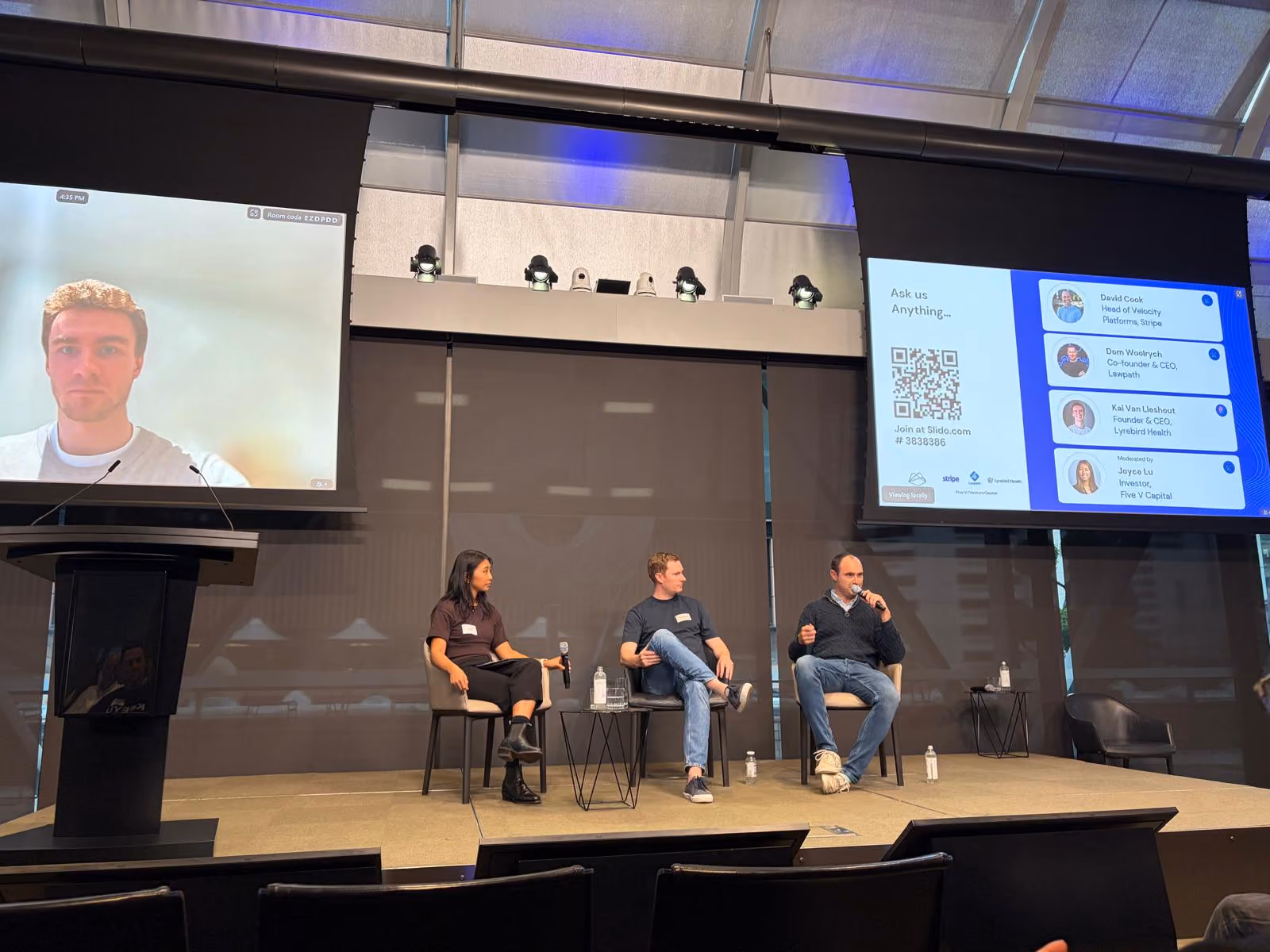 Panelists talking on stage