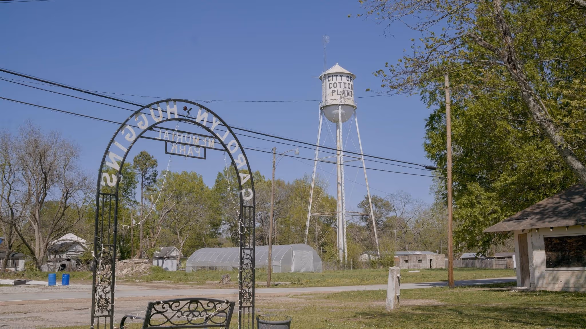 Cotton Plant Arkansas water tower and town entrance featured in Roots and Reefer documentary showcasing BOLD Team cannabis cultivation facility location.