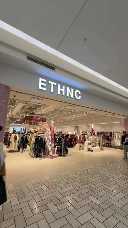 Interior of an ETHNC fashion store with an LED display screen installed by Tod Technologies