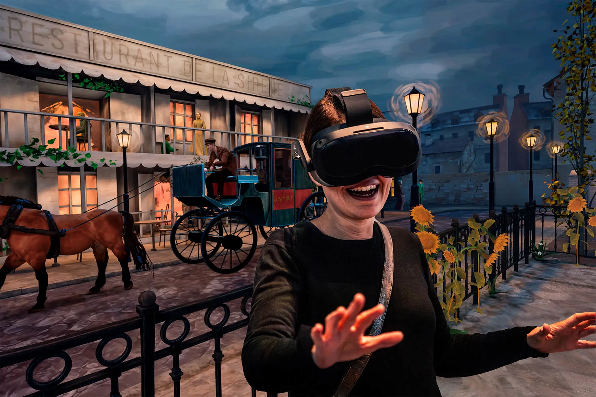 Woman smiling and reaching forward while wearing a virtual reality headset with a background of an old horse carriage and a building at dusk.