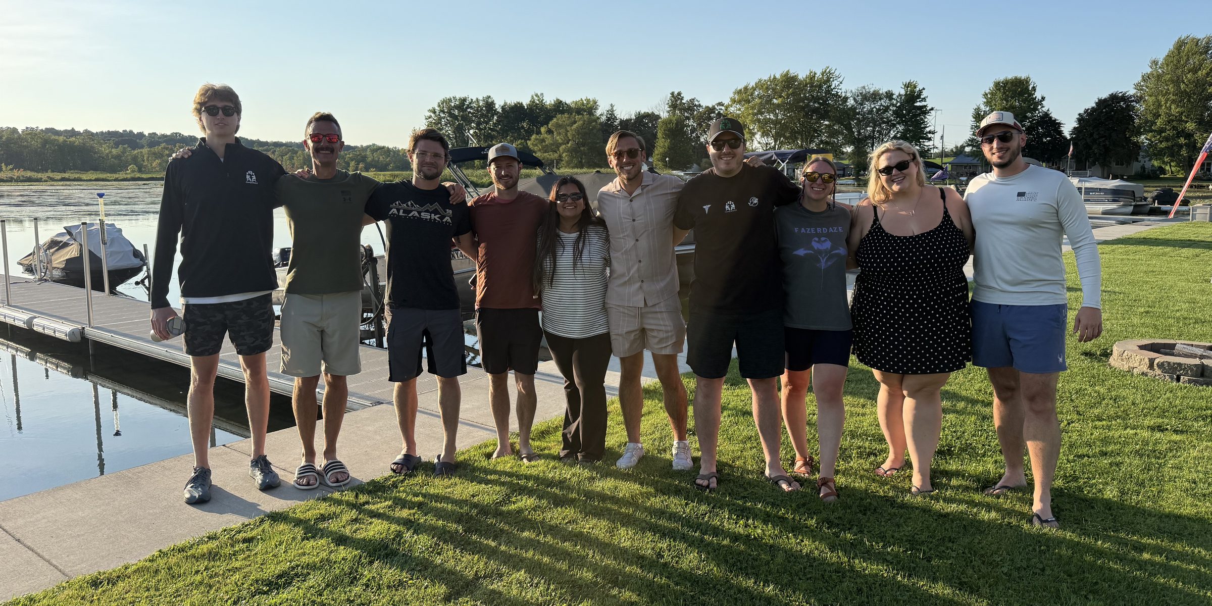 The Comprehend team together outdoors by the water