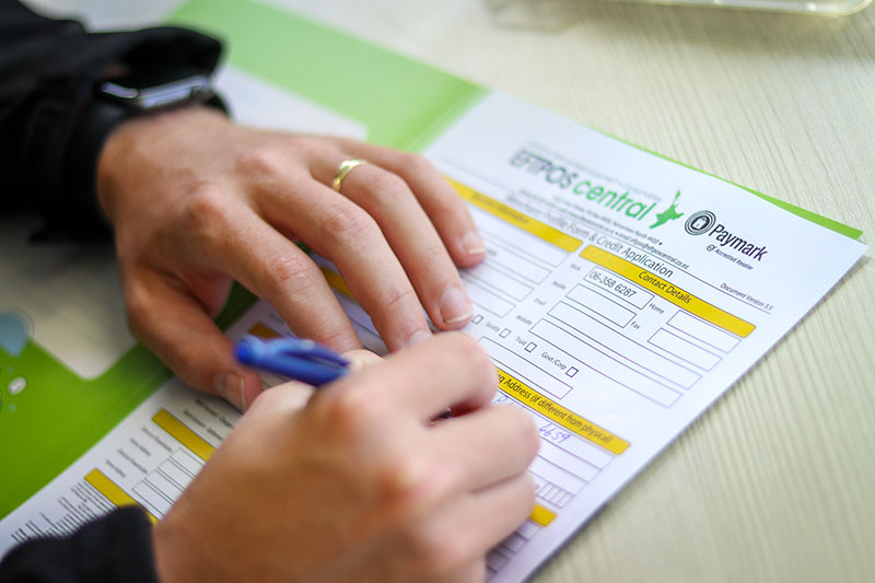 EFTPOS Central paperwork being filled out
