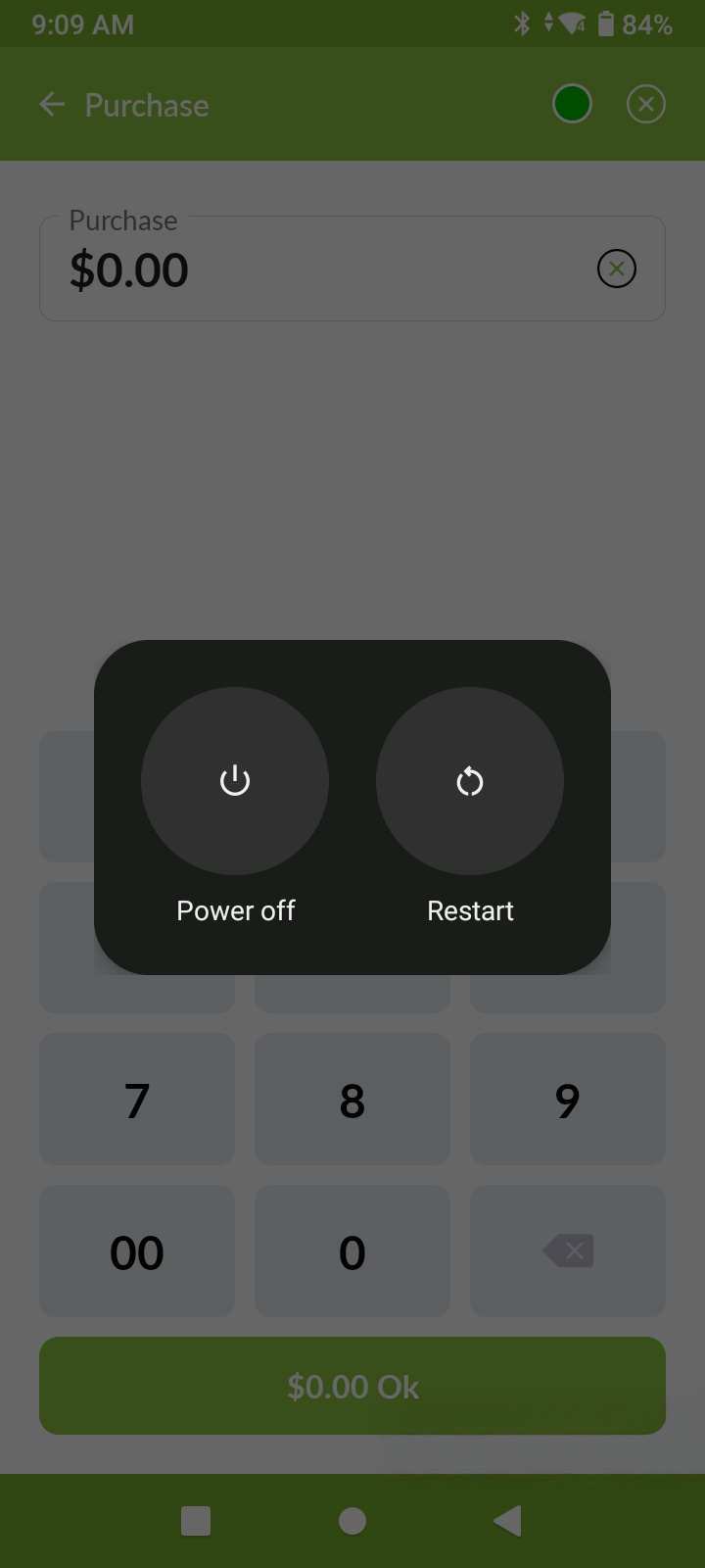 Mobile screen showing a purchase app with a numeric keypad and a pop-up with Power off and Restart options.