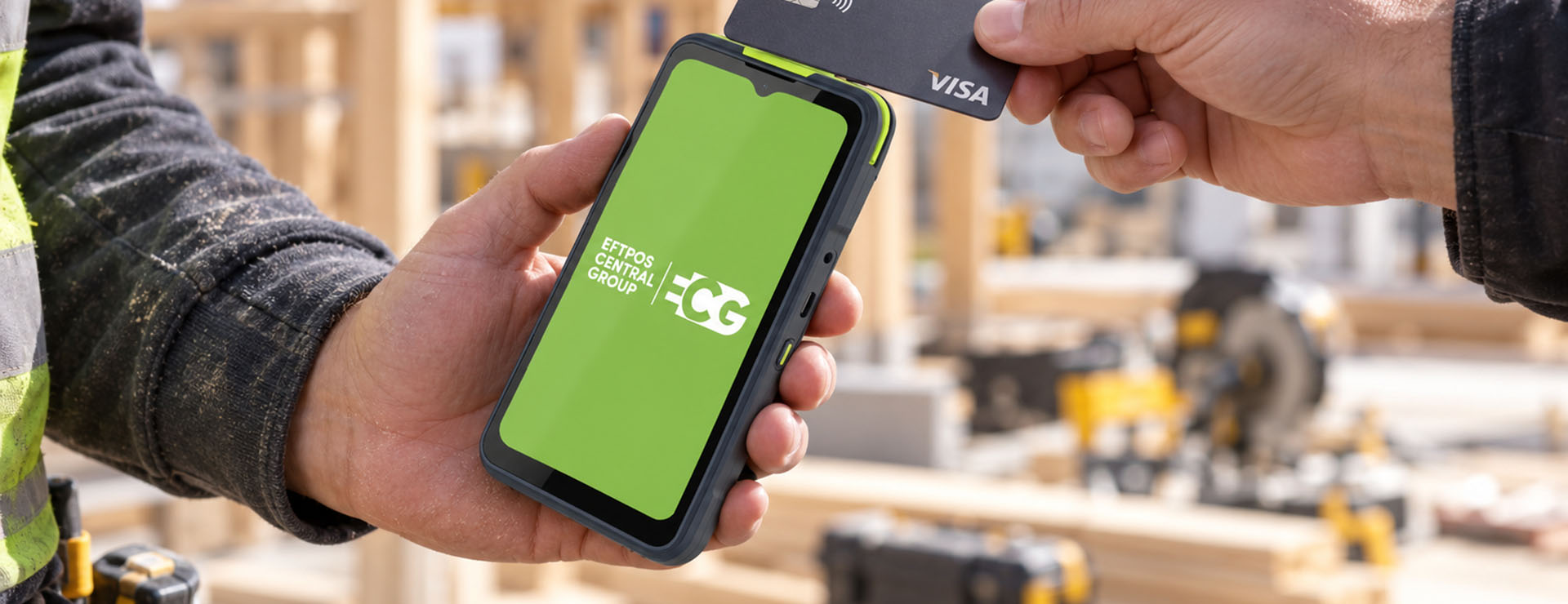 Builder using EFTPOS terminal to take payment on site