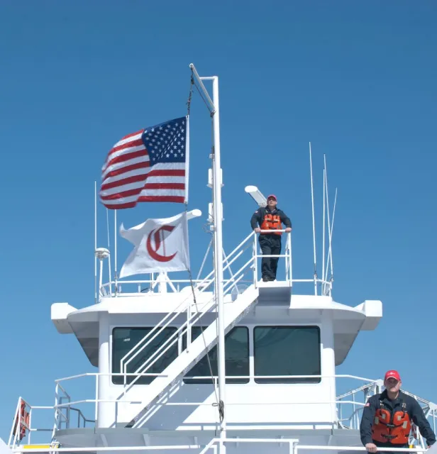 american flag with canal barge flag in ship