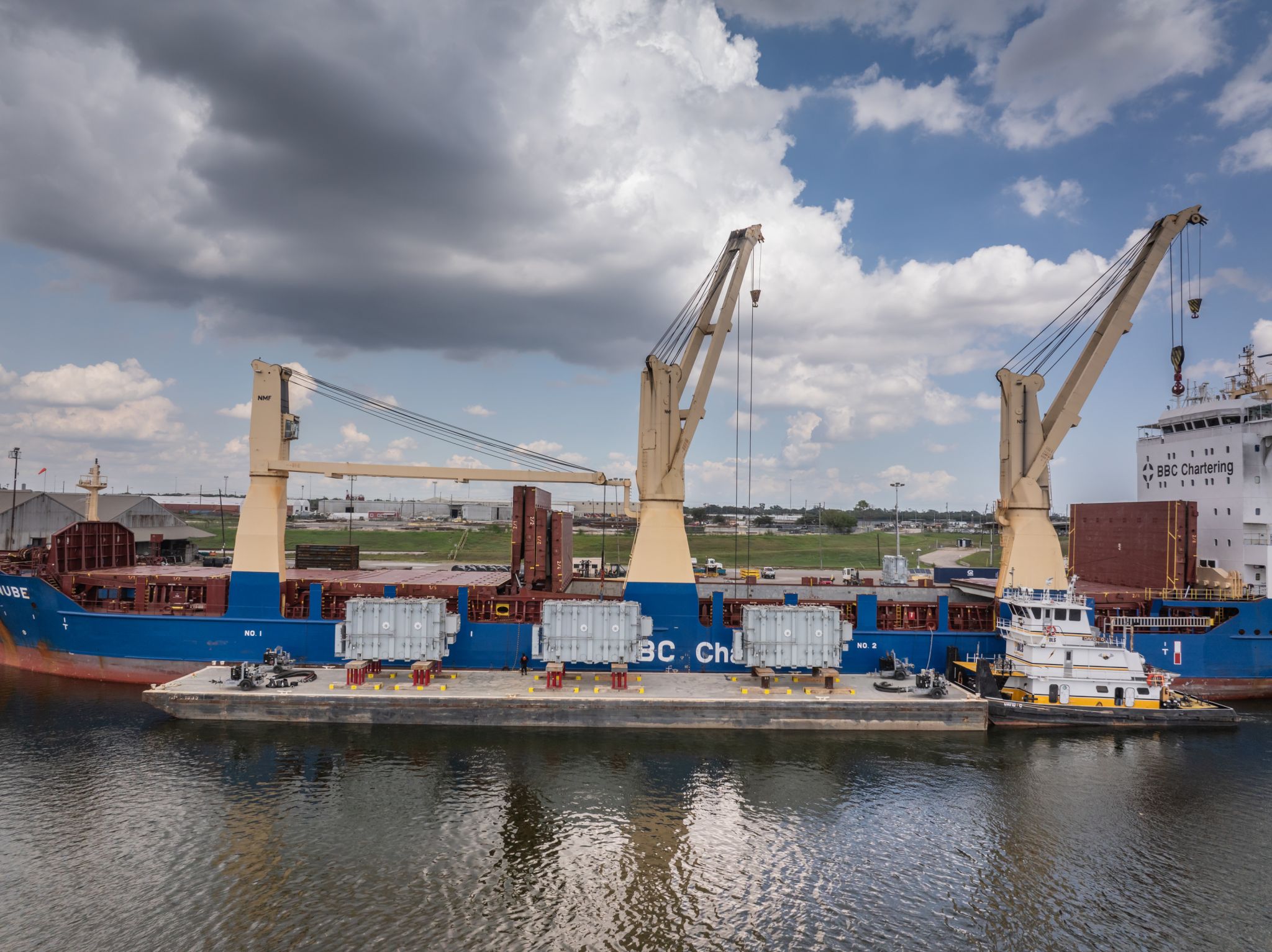 ship with liquid cargo passing under a bridge