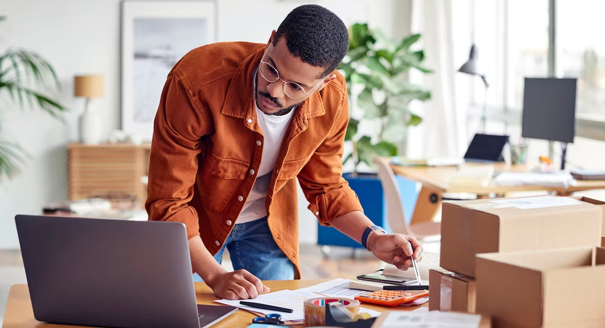 man wearing orange shirt - BigCommerce Alternative