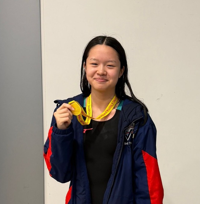 Tran Isobel Anh Gia celebrates her 200m IM gold medal for Harry Wright Swim School at the Division 2 Part 2 Long Course meet in Kwun Tong, Hong Kong