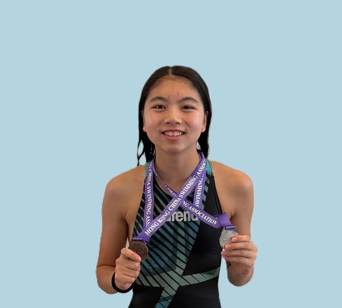 Harry Wright Swim School swimmer holding two medals won at the Division 3 Part 3 Long Course Age Group Competition, Hong Kong