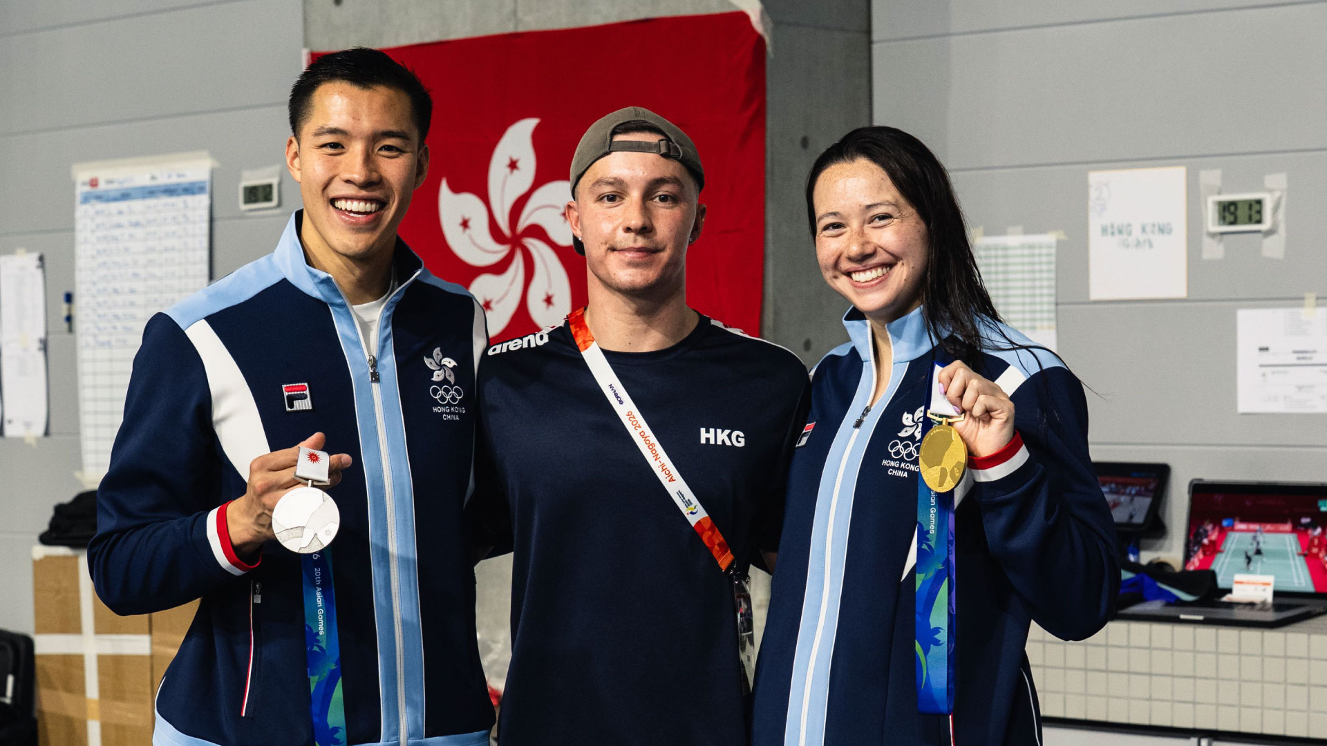 Olympic medalist Siobhan Haughey, Hong Kong swimmer Ian Ho and Harry Wright swimmer Adam Chillingworth with their medals at the 2026 Asian Games