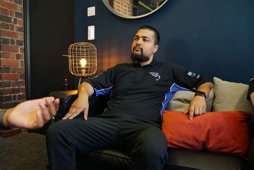 Nikesh sat on a couch in the office