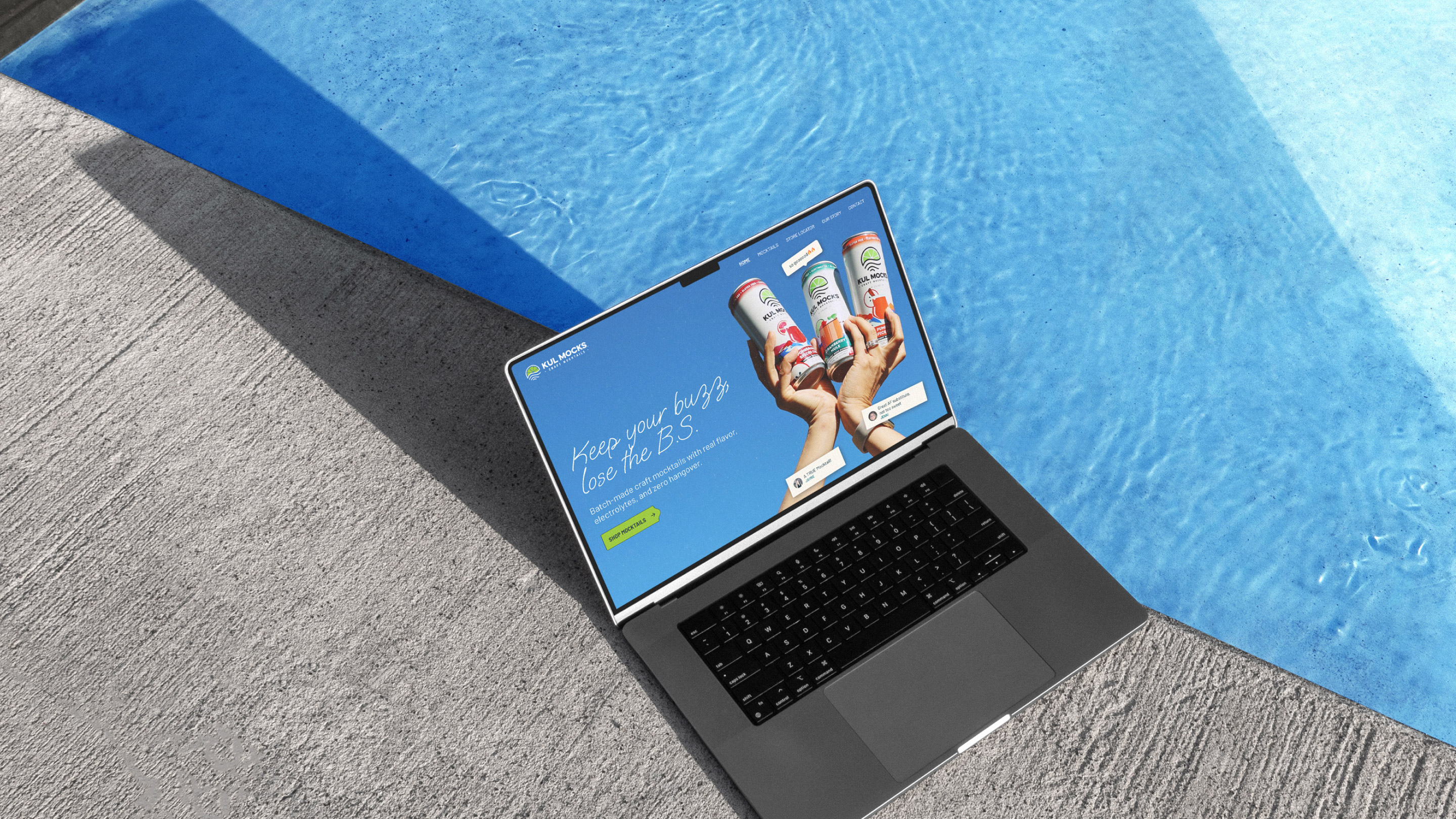 Laptop showing a mocktail website with hands holding three cans against a blue poolside background.