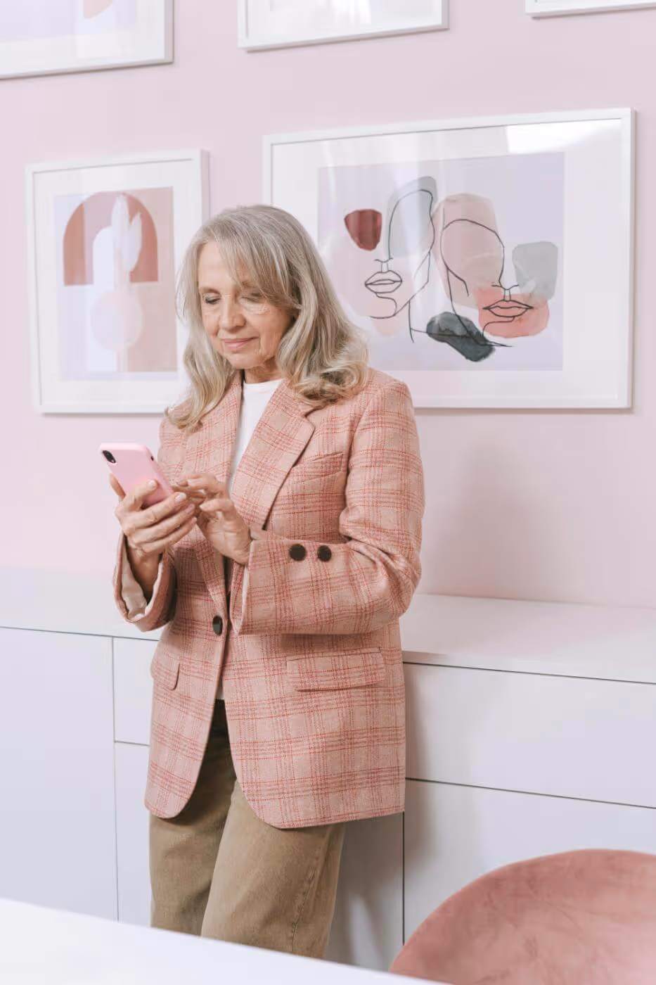Stylish older woman looking at her phone