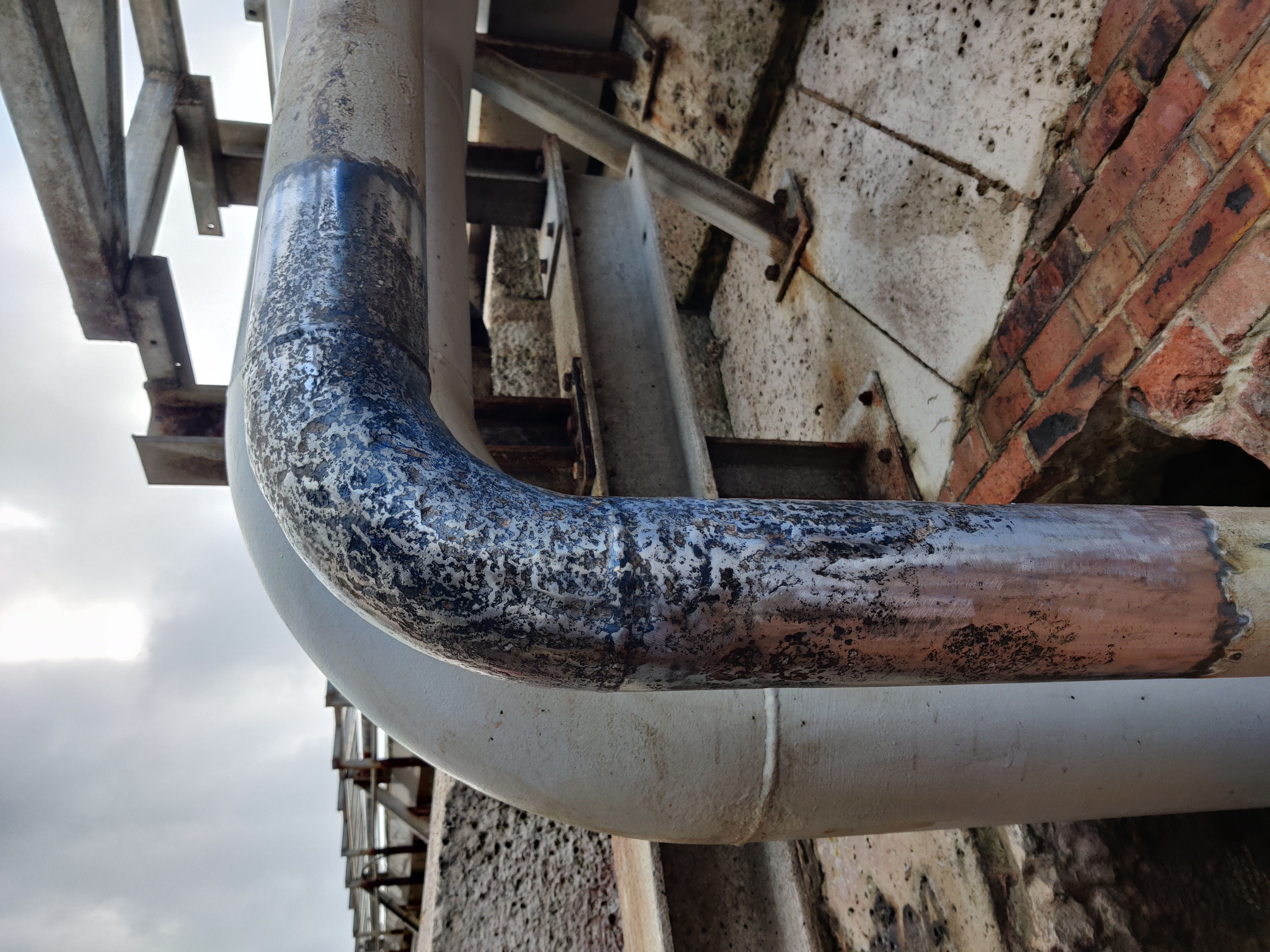 Temporary clamp installed on live fuel oil line before composite repair