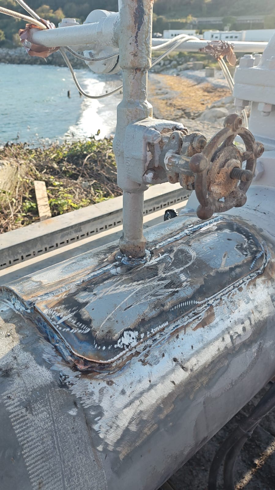 Pre-installed welded saddle over the 12-inch fuel-oil line defect