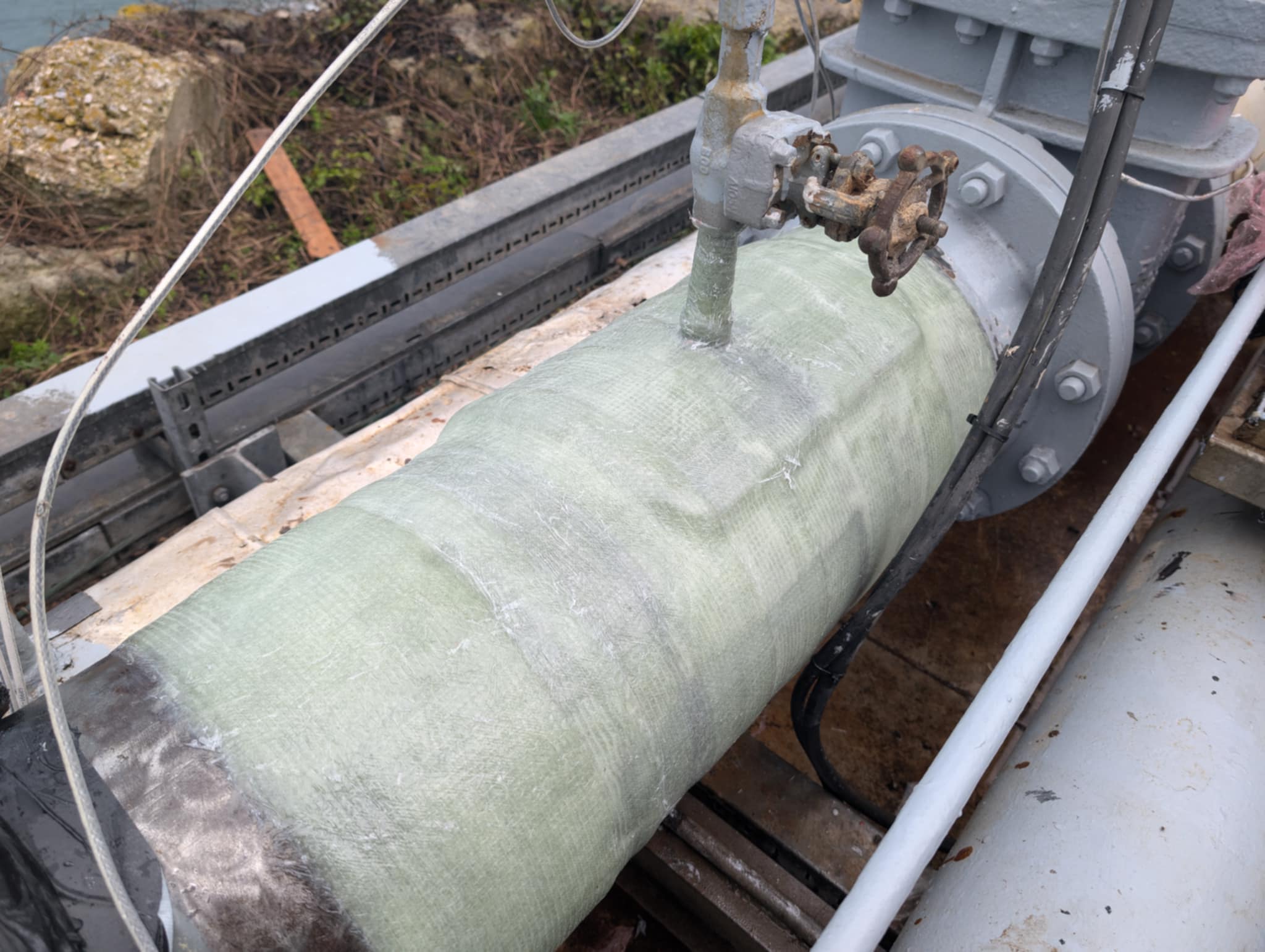Completed six-layer BioWrap 102 repair over the 12-inch tee and welded saddle