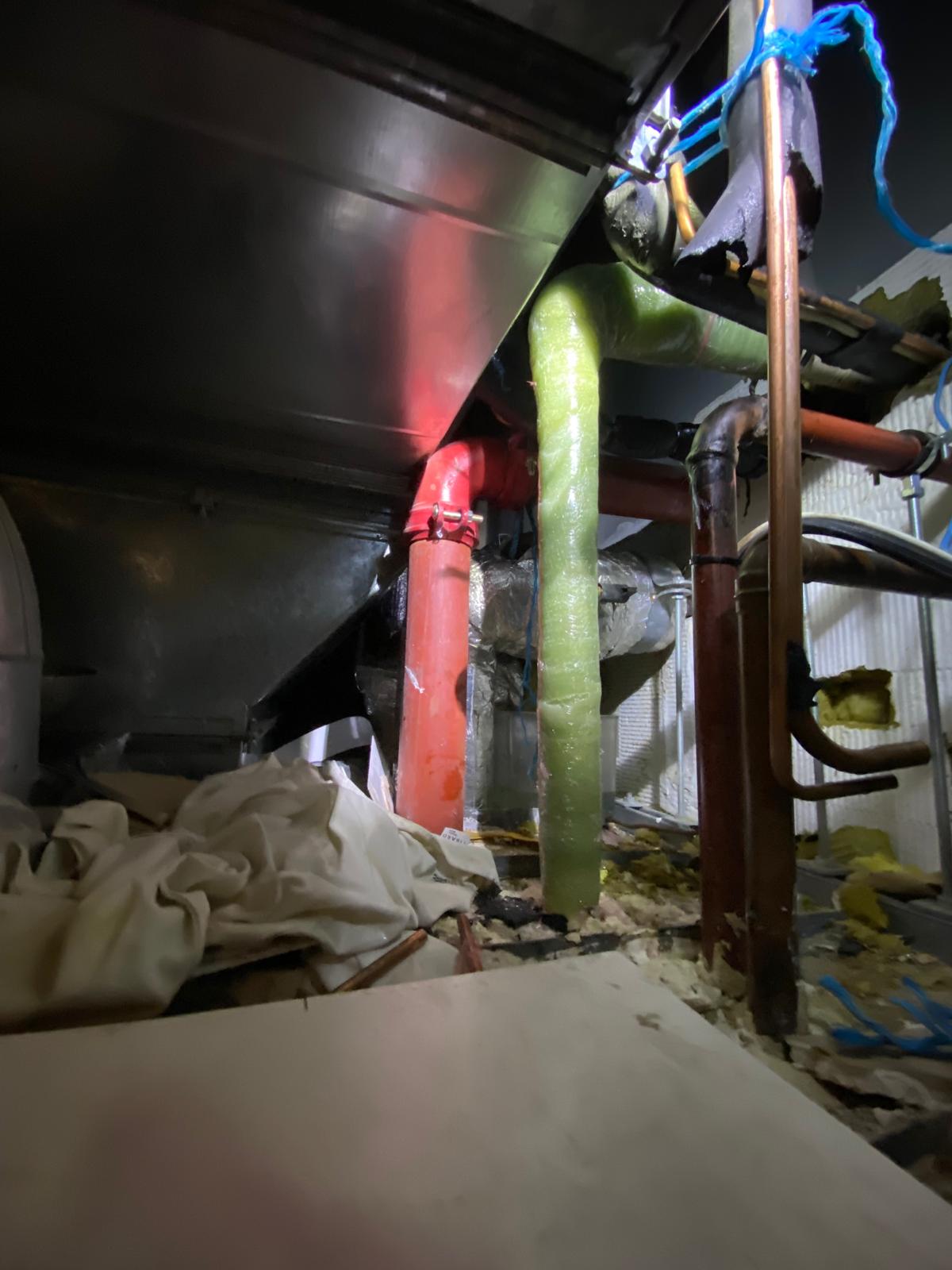 Completed BioWrap 102 overwrap through clamp, elbow and adjacent pipework