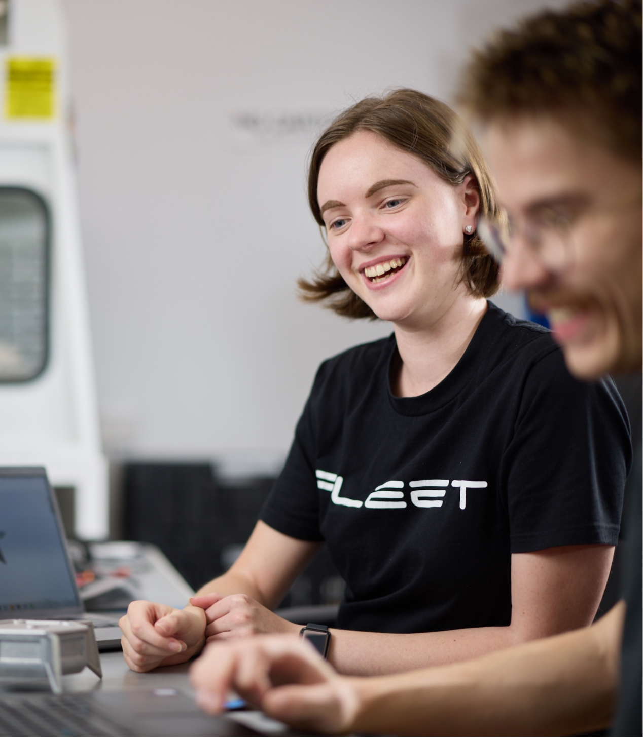 A Fleet team member looking happy