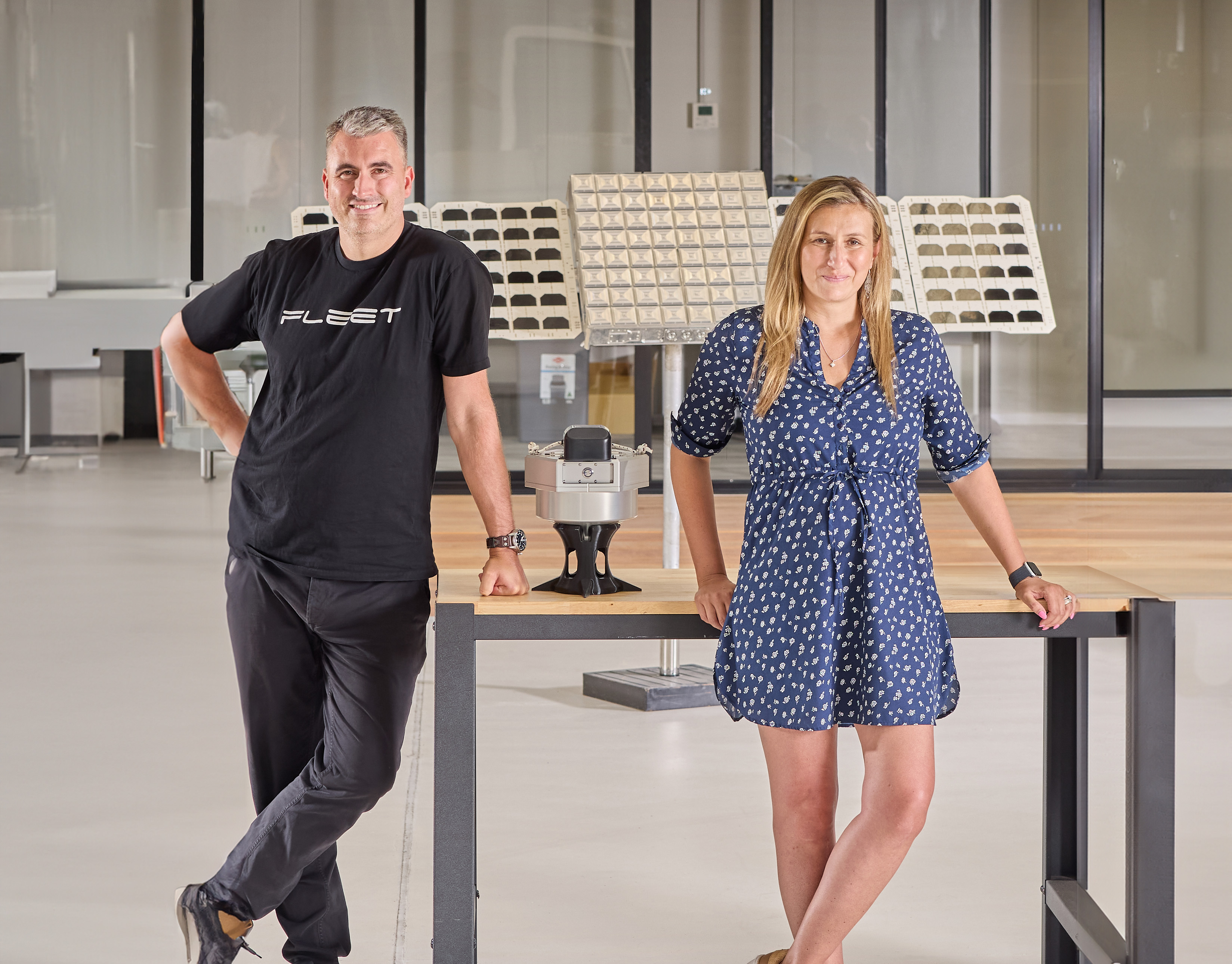 Fleet founders standing near table