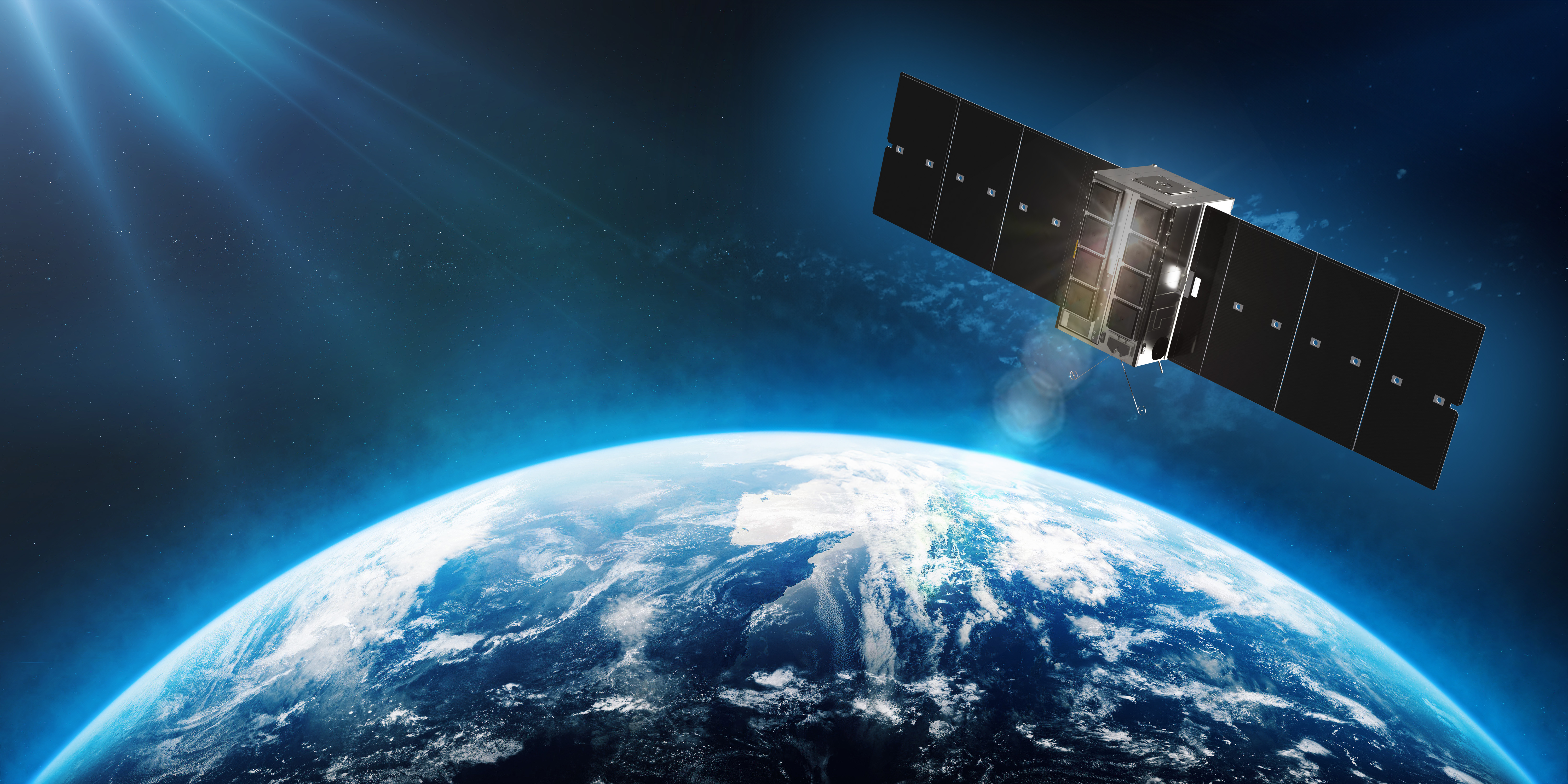 An image of a satellite in space above earth.