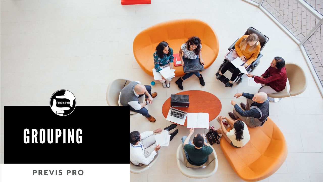 Overhead view of diverse team collaborating around orange curved seating