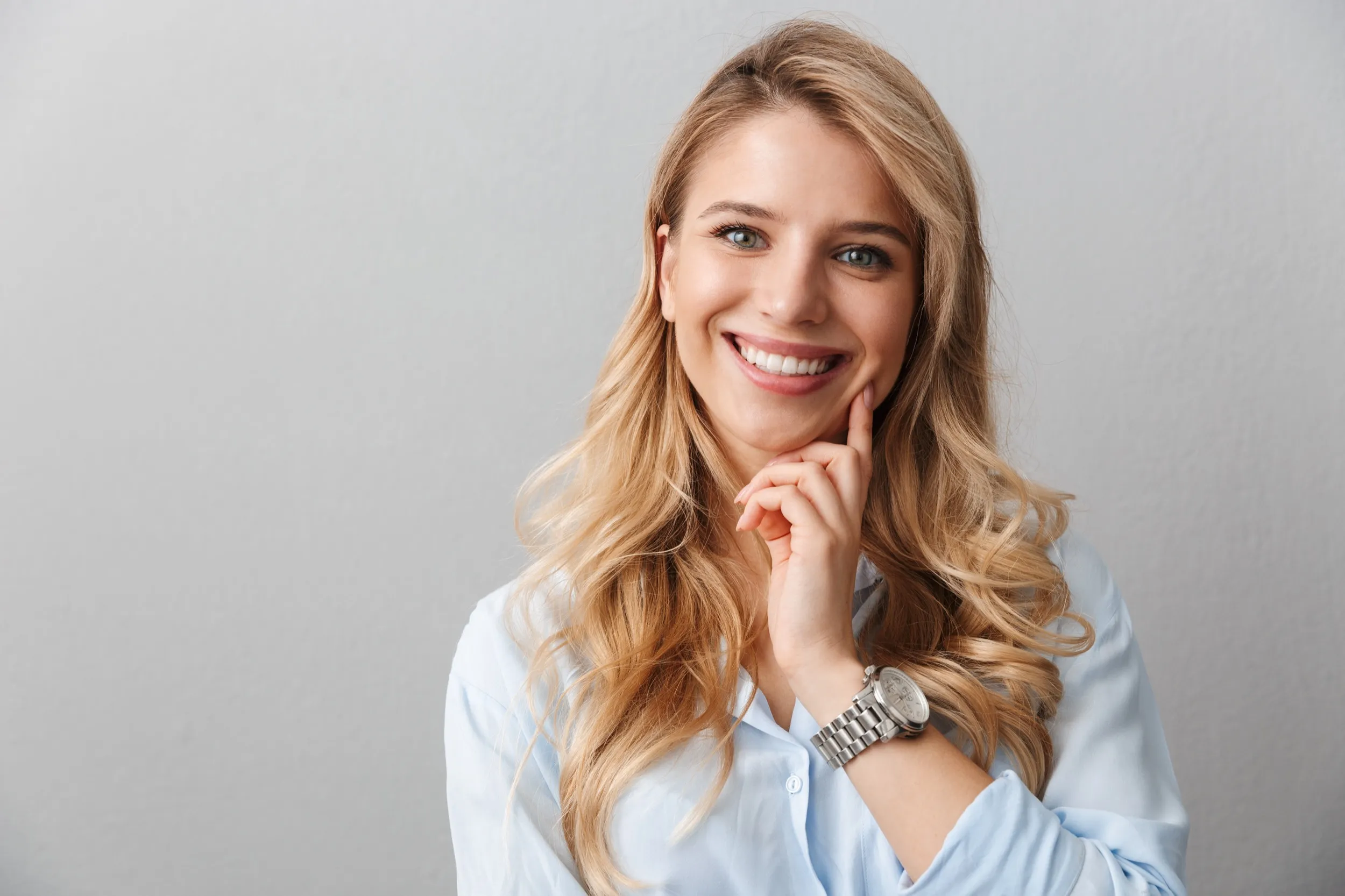 A woman smiling and posing for a picture