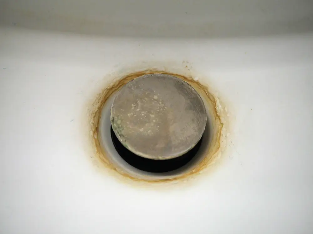 Sink drain in Albuquerque NM with hard water stains and build up