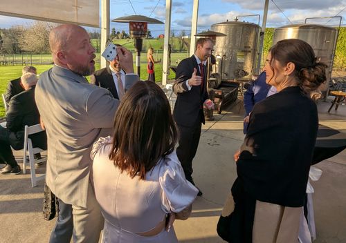 Erik performing magic at a Wedding