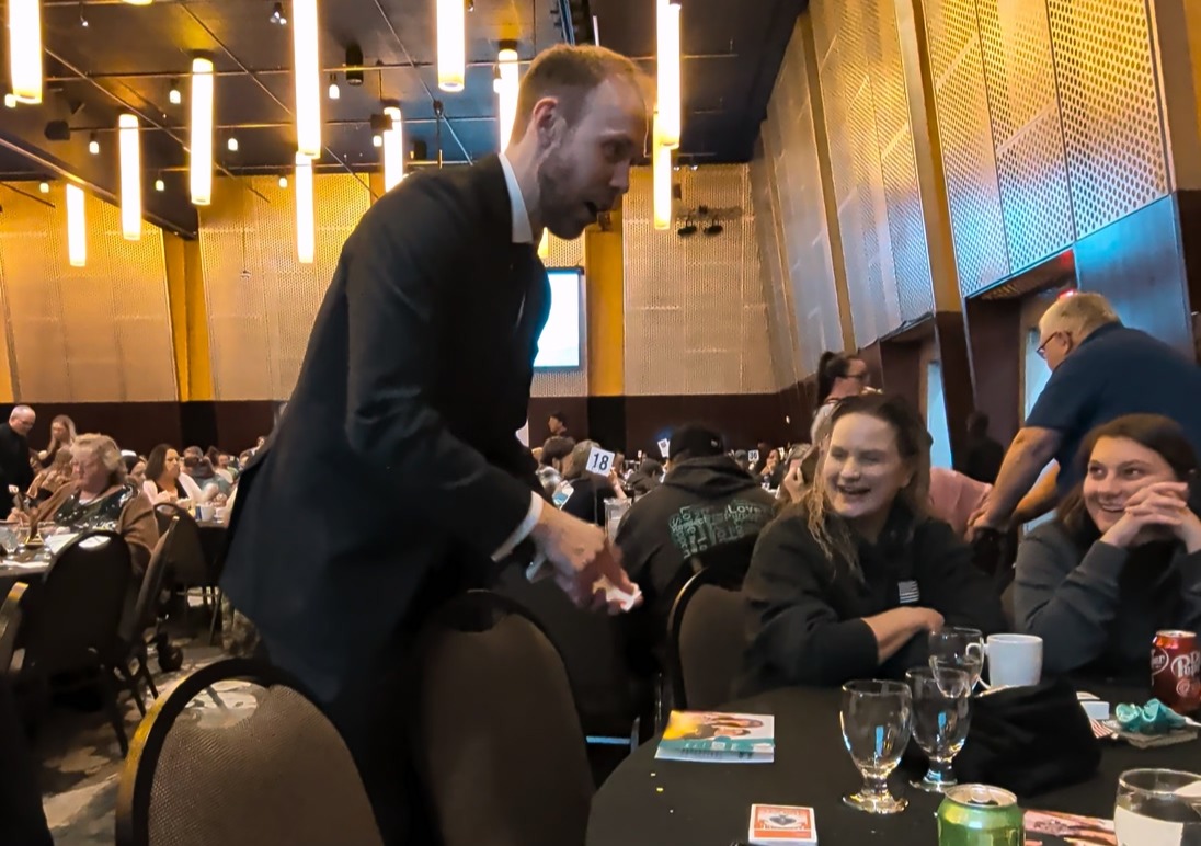 Erik performing magic for corporate event at Portland City Grill 