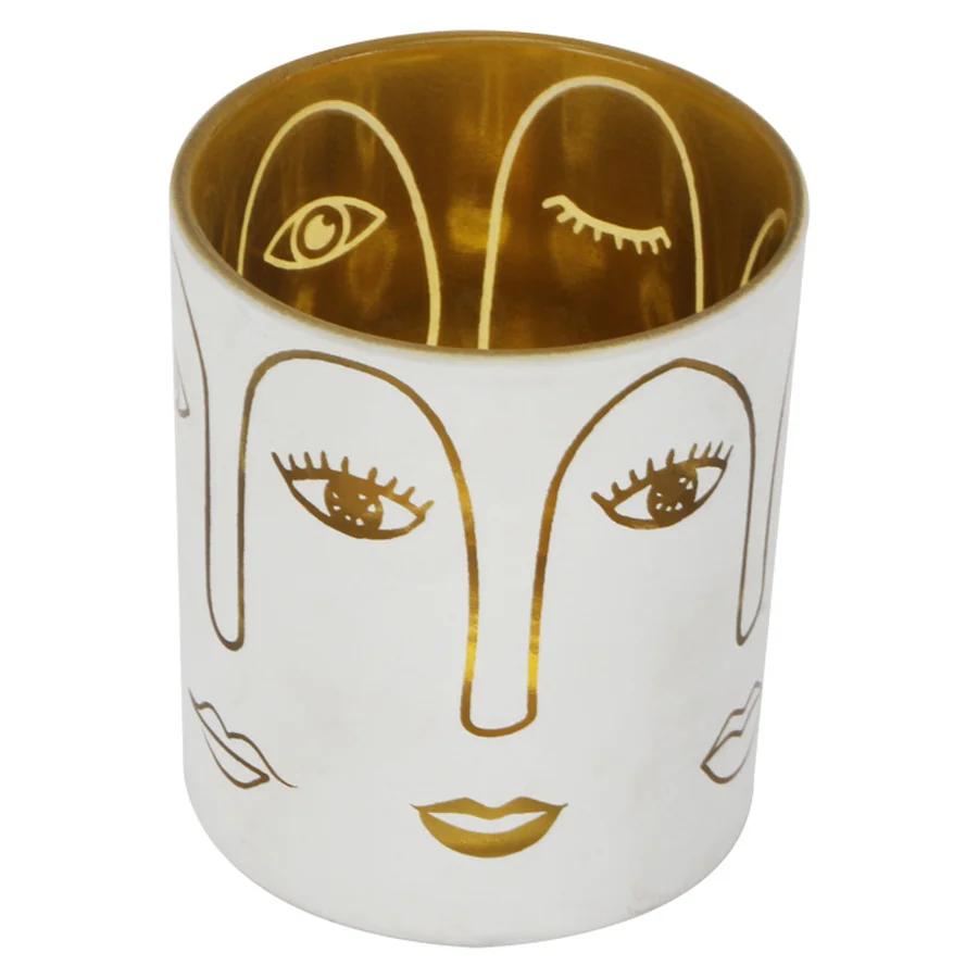 White ceramic face-pattern candle holder.