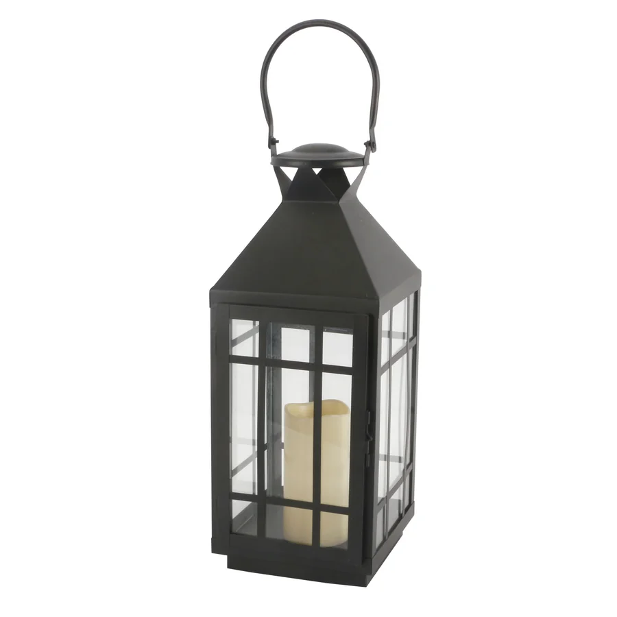 Black metal lantern with glass panels and candle.