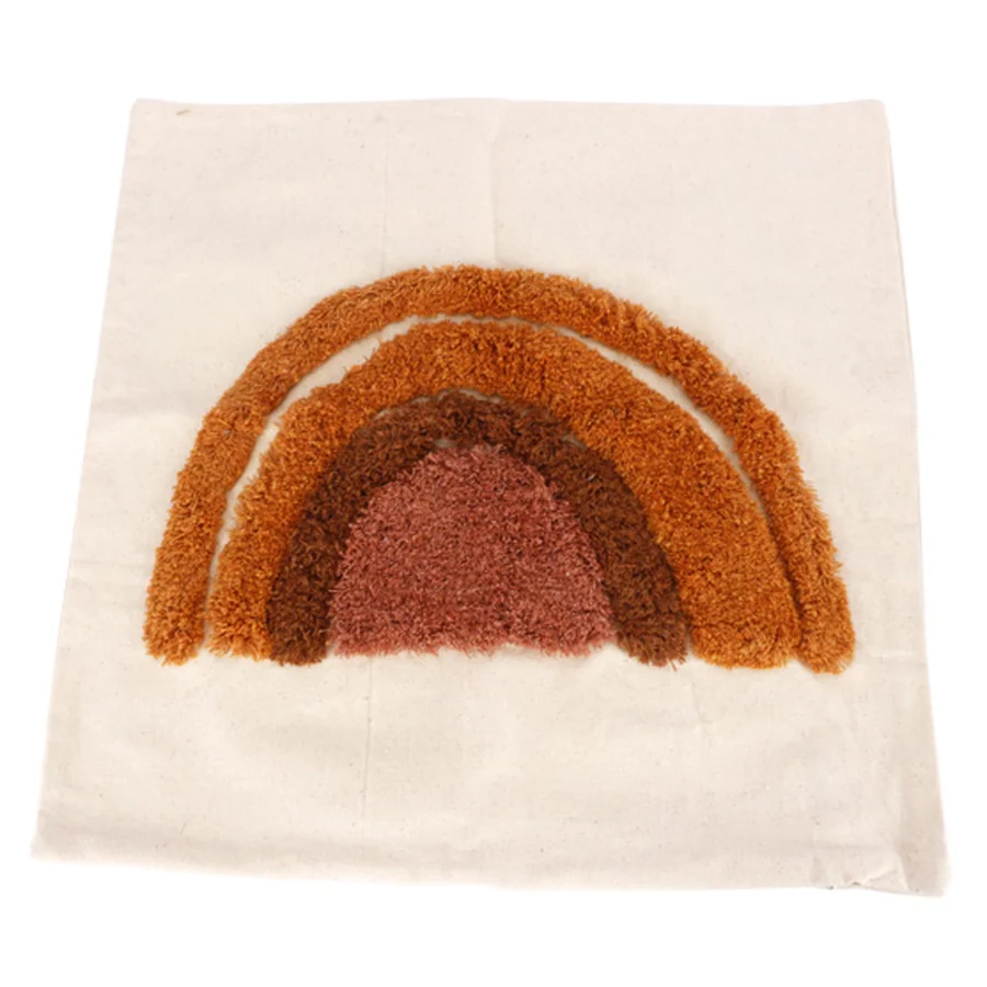 Cotton fabric pillow with rainbow embroidery.
