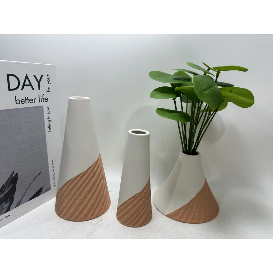 White ceramic cone-shaped vases with brown texture.