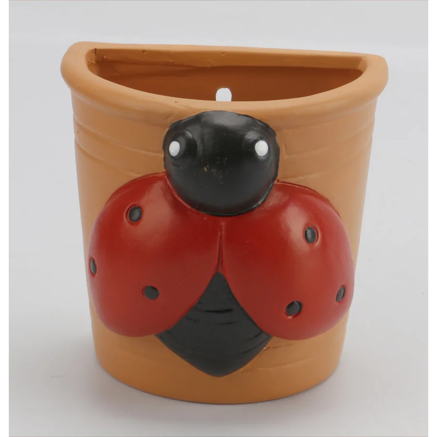 Terracotta ladybug wall planter.