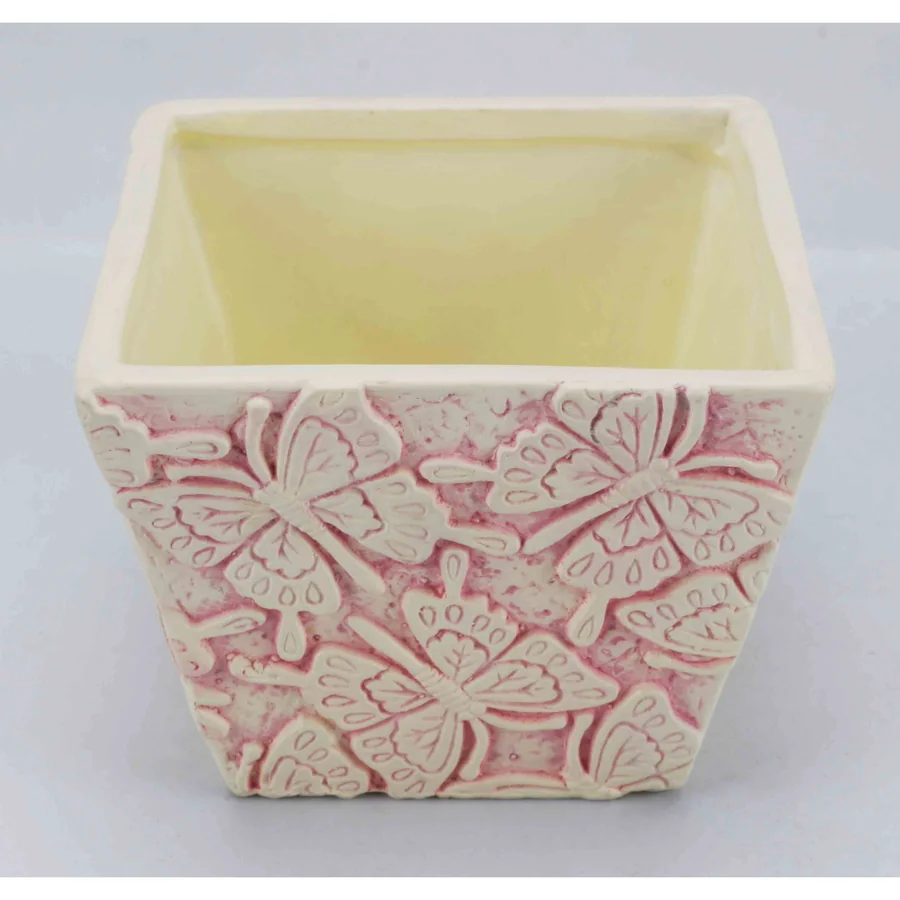 White ceramic square planter with butterfly design.