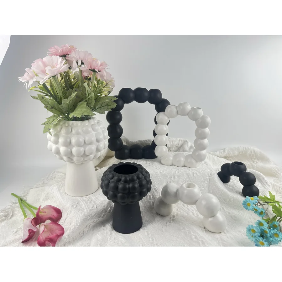 Black and white bead-style decorative vases.