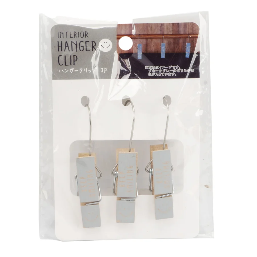 Three hanger clips for a clothes rail in a retail pack.