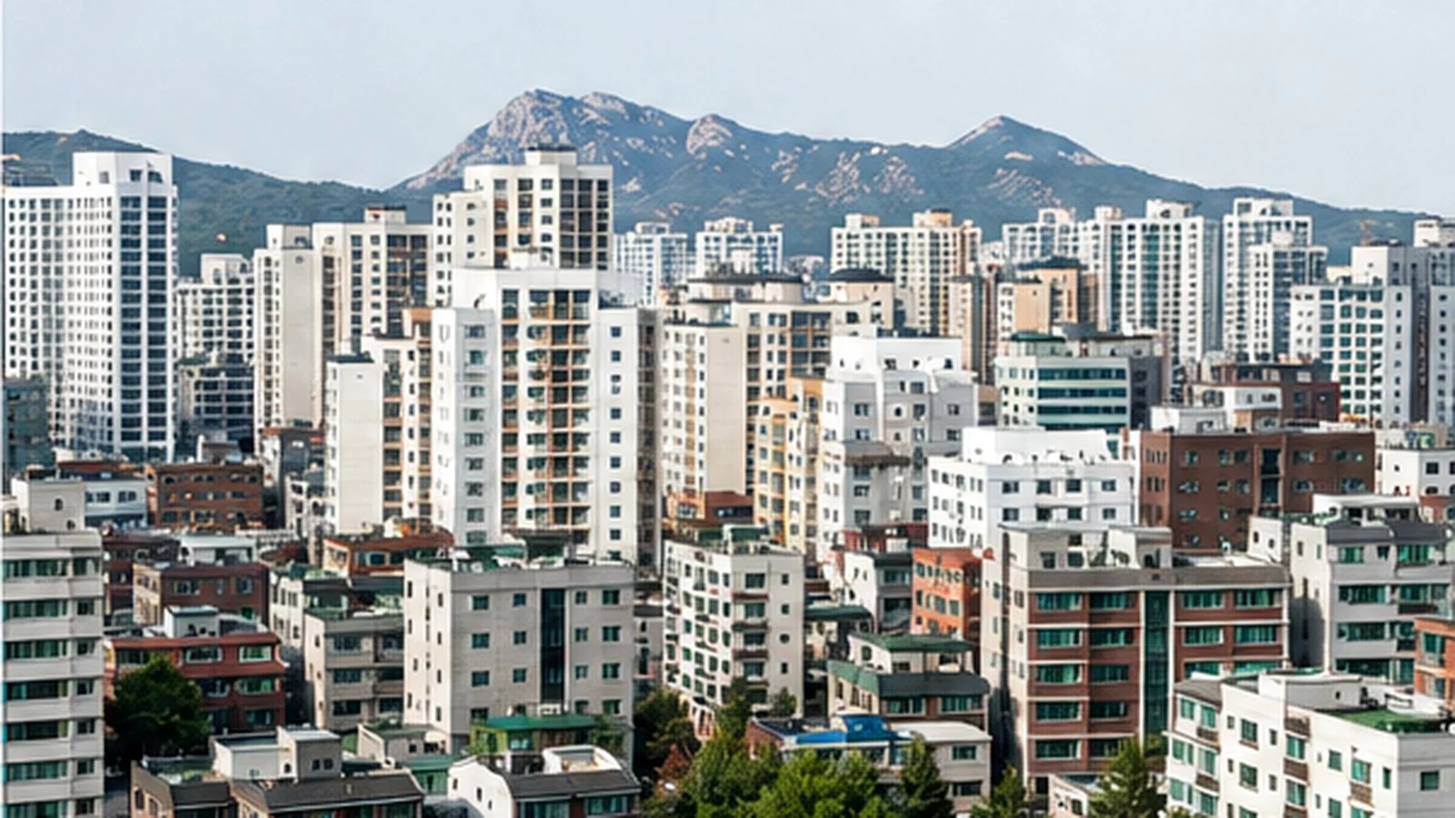 A Seoul neighborhood with apartment towers and smaller residential buildings.