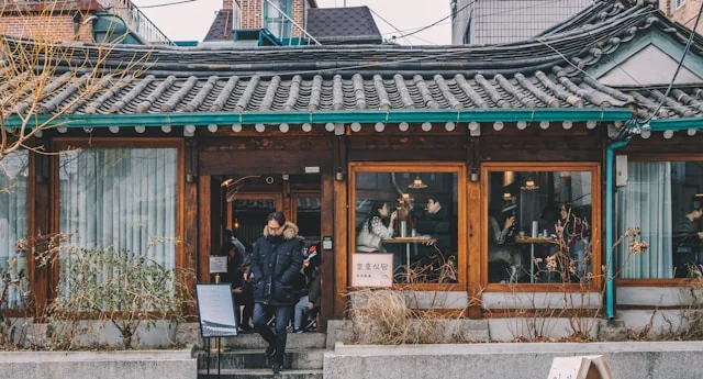 A restaurant entrance in a traditional Korean-style building.