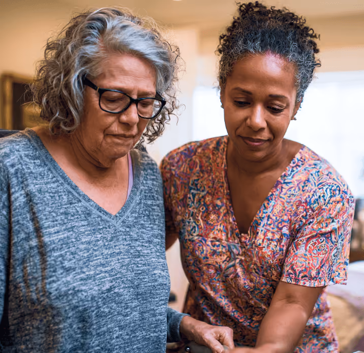 In-home caregiver assisting elderly patient