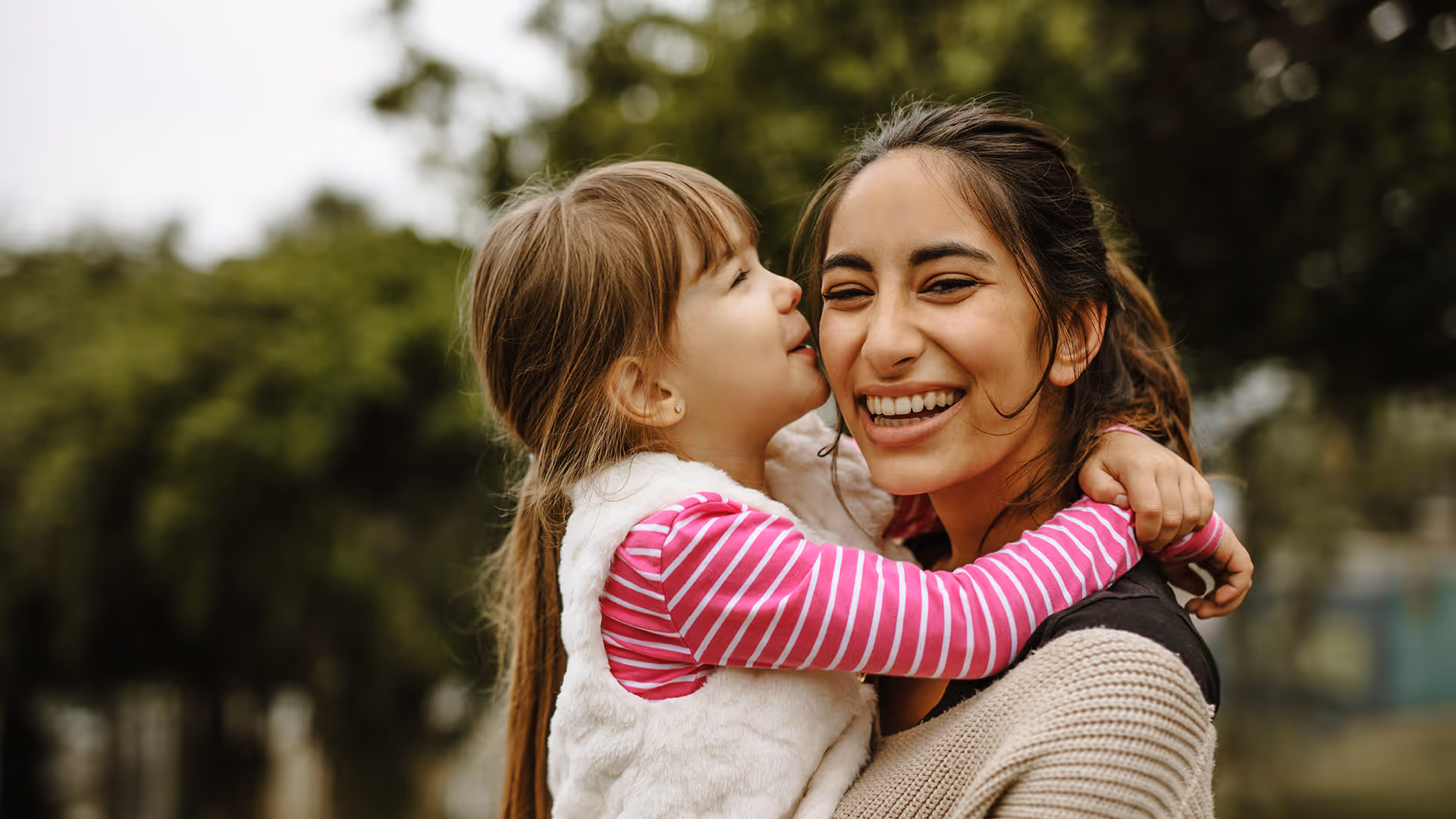 As a household employee, a nanny plays with a child outside