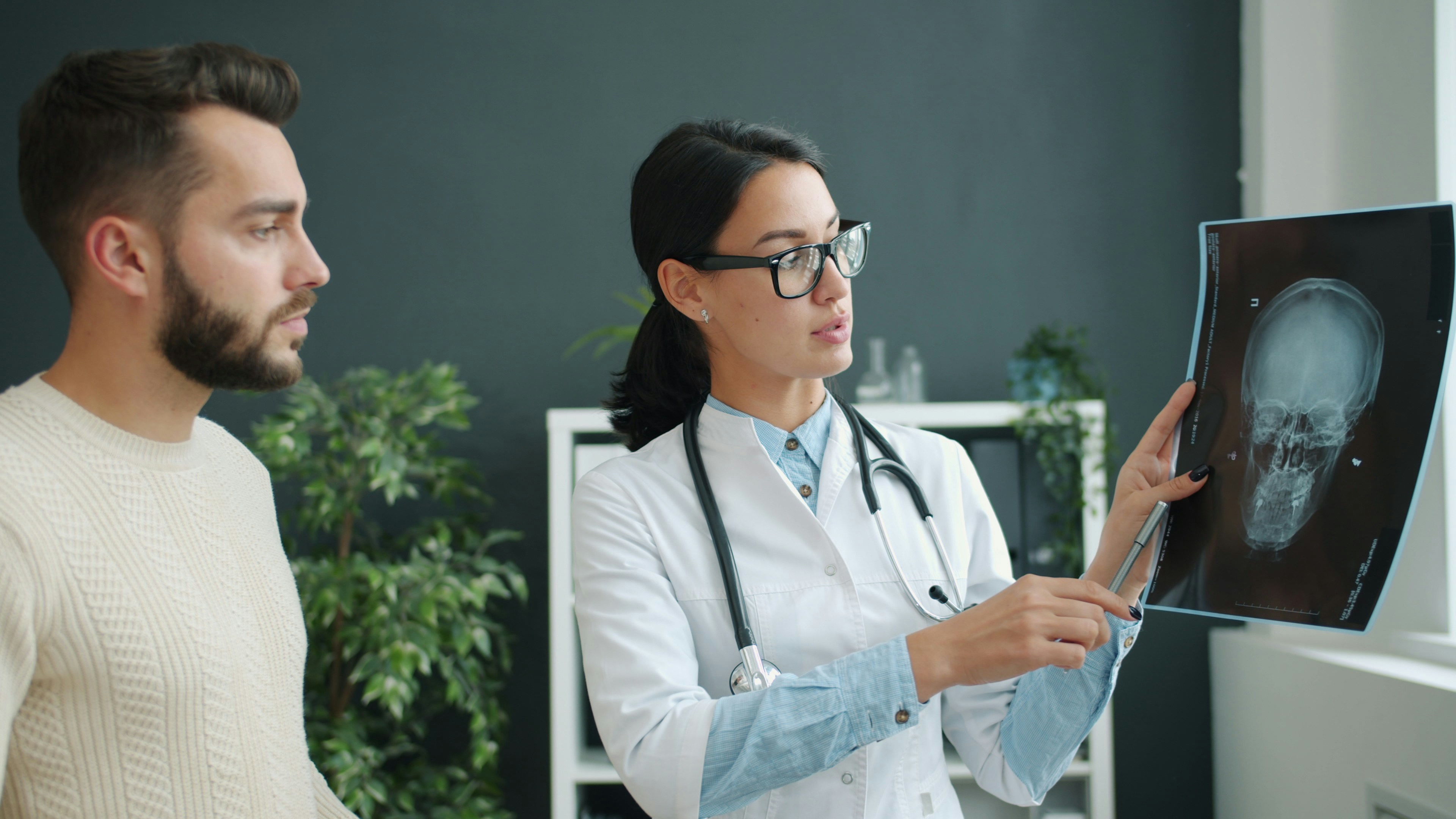 Two people reviewing X-rays