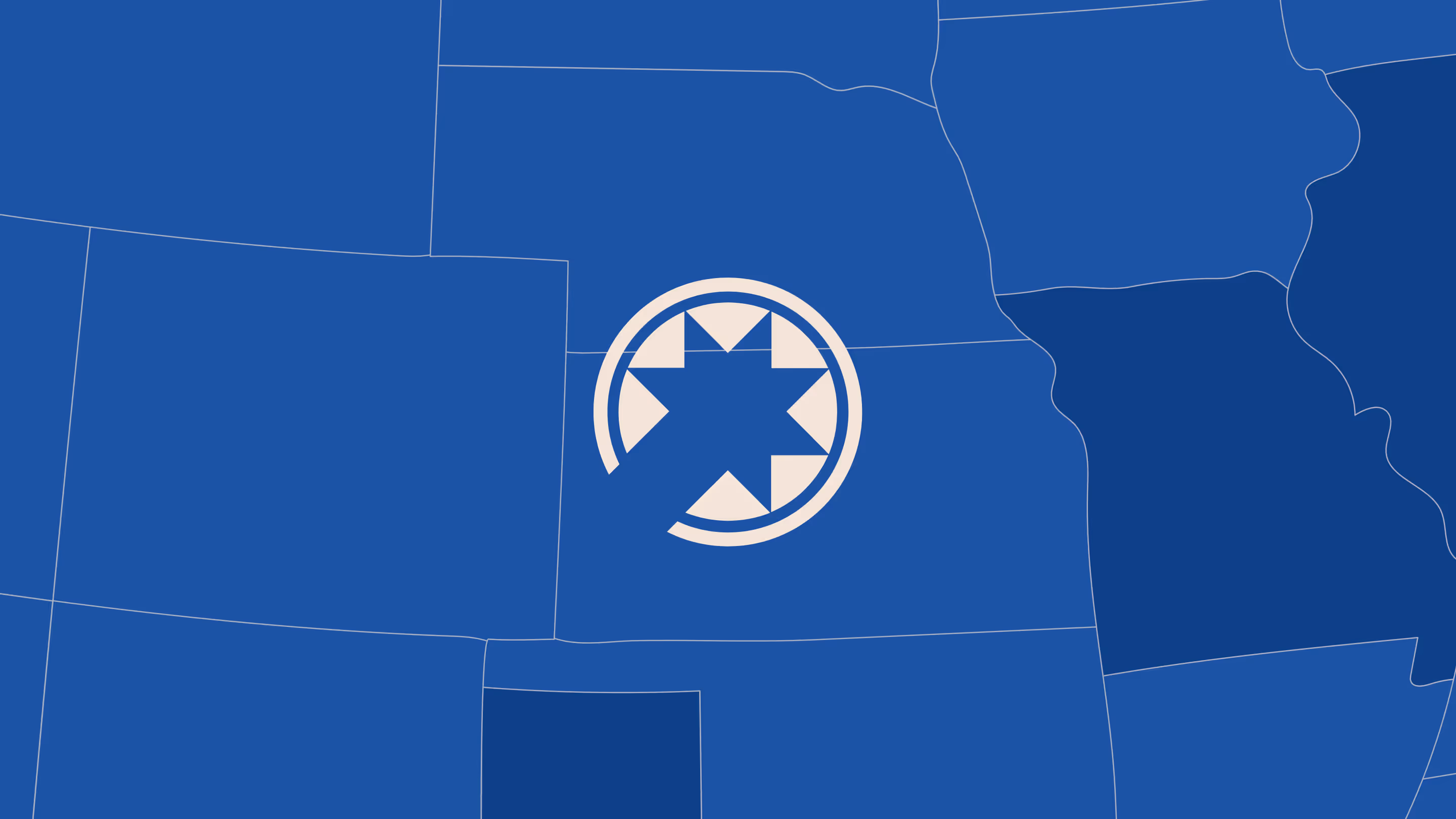 Blue map of central U.S. with white star emblem centered over Wyoming.