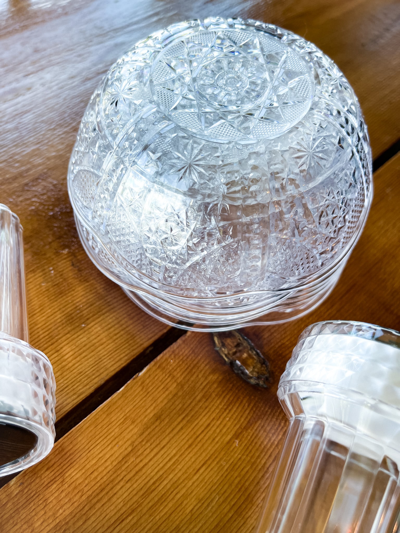 on a table: solar lights, e6000, and plastic bowls 