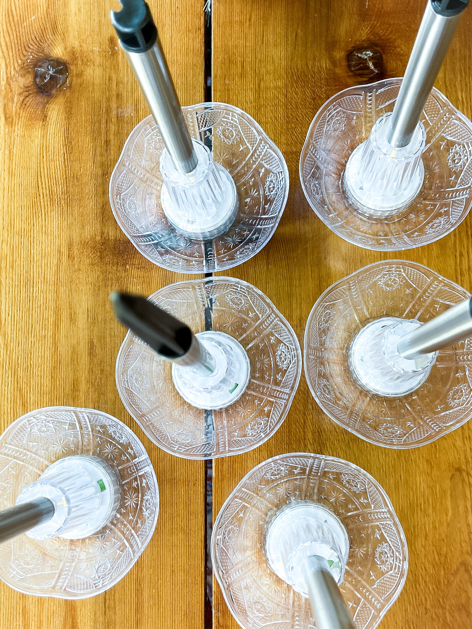 Upgraded solar lights on a table with plastic bowls added to the top