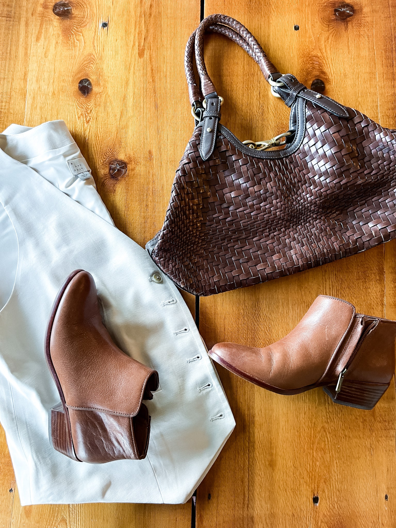 tan vest, brown basket weave leather purse, brown leather booties